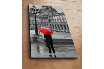 Lerretsbilde 70x100 cm - Person som står med en rød paraply i et regnfullt bymiljø foran en historisk bygning - Rød / Svart - Interiør - Maleri & posters - Lerretsbilder