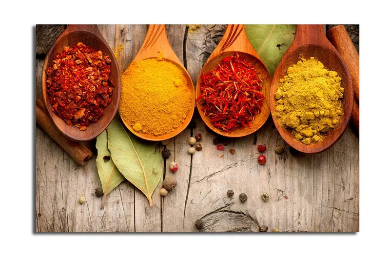 Lerretsbilde 70x45 cm - Fargerike krydder i treskjeer, Rød / Gul / Oransje