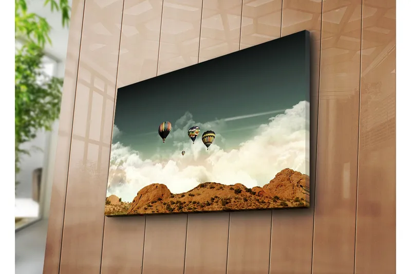 Lerretsbilde 70x45 cm - Flere varmluftsballonger som svever over en dramatisk himmel og et fjellandskap - Mørk blå / Beige / Hvit - Interiør - Maleri & posters - Lerretsbilder