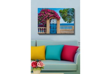Lerretsbilde - Blomstrende bougainvillea ved en smijernsport med havutsikt - Rosa / Blå / Grønn - Interiør - Maleri & posters - Lerretsbilder