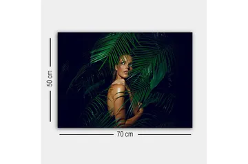 Lerretsbilde - Kvinne delvis skjult bak grønne palmeblader - Mørkegrønn / Hudtone / Svart - Interiør - Maleri & posters - Lerretsbilder