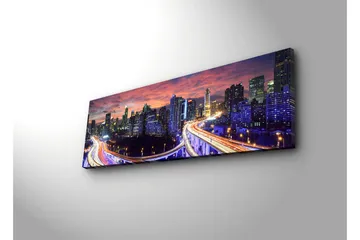 Lerretsbilde med LED-belysning 30x90 cm - Bysilhuett i skumringen med lysstråler fra veiene - Mørk blå / Oransje / Lilla - Interiør - Maleri & posters - Lerretsbilder