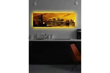 Lerretsbilde med LED-belysning 30x90 cm - Bysilhuett med bro i solnedgangens gylne lys - Gull / Svart / Oransje - Interiør - Maleri & posters - Lerretsbilder