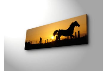 Lerretsbilde med LED-belysning 30x90 cm - Silhuett av en hest som galopperer ved solnedgang - Mørk brun / Oransje / Gul - Interiør - Maleri & posters - Lerretsbilder