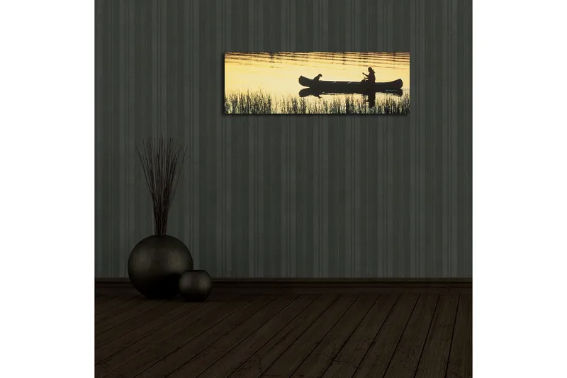 Lerretsbilde med LED-belysning 30x90 cm - Silhuett av en kano med en person og en hund i solnedgangens lys - Gull / Svart - Interiør - Maleri & posters - Lerretsbilder