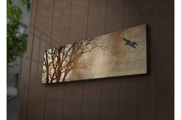 Lerretsbilde med LED-belysning 30x90 cm - Silhuett av et tre med en fugl i flukt mot en mykt tonet bakgrunn - Mørk brun / Beige / Svart - Interiør - Maleri & posters - Lerretsbilder