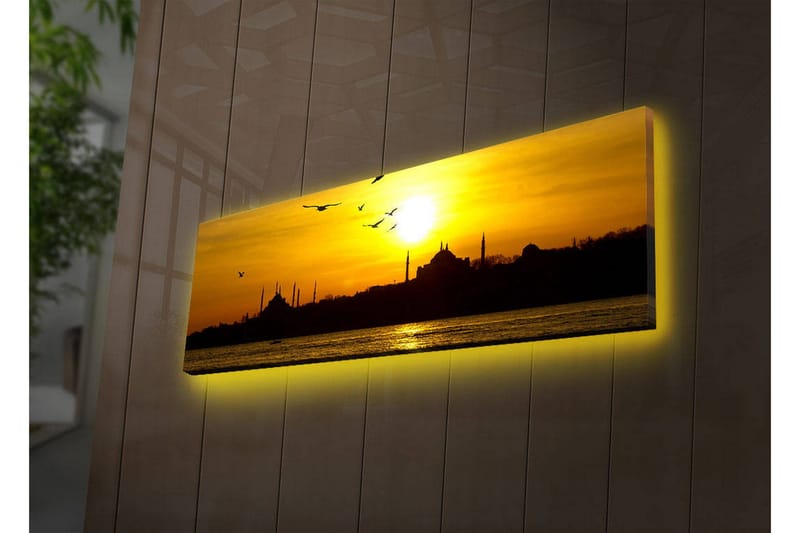 Lerretsbilde med LED-belysning 30x90 cm - Solnedgang over en bysilhuett med fugler i flukt, Gull / Svart / Oransje