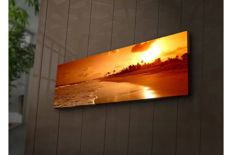 Lerretsbilde med LED-belysning 30x90 cm - Solnedgang over en strand med palmer i silhuett, Oransje / Gull / Brun