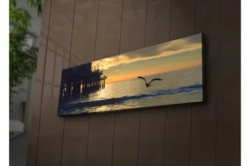 Lerretsbilde med LED-belysning 30x90 cm - Solnedgang over havet med en fugl i flukt - Oransje / Blå / Grå - Interiør - Maleri & posters - Lerretsbilder