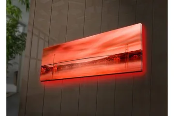 Lerretsbilde med LED-belysning 30x90 cm - Storslått utsikt over en bro over en speilblank vannflate i solnedgangens farger - Rød / Oransje / Svart - Interiør - Maleri & posters - Lerretsbilder