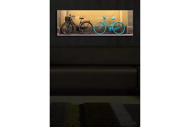 Lerretsbilde med LED-belysning 30x90 cm - Sykler i kontrastfarger mot en gul vegg - Svart / Turkis / Gul - Interiør - Maleri & posters - Lerretsbilder