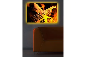 Lerretsbilde med LED-belysning 45x70 cm - Gitarist spiller elektrisk bass omgitt av flammende flammer - Oransje / Svart / Gul - Interiør - Maleri & posters - Lerretsbilder