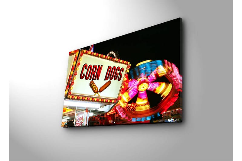 Lerretsbilde med LED-belysning 45x70 cm - Lyst og fargerikt skilt med teksten CORN DOGS og en snurrende karusell i bakgrunnen - Rød / Gul / Blå - Interiør - Maleri & posters - Lerretsbilder