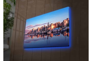 Lerretsbilde med LED-belysning - Bysilhuett ved solnedgang med refleksjoner i vannet - Blå / Oransje / Lilla - Interiør - Maleri & posters - Lerretsbilder
