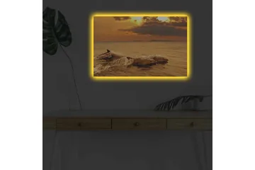 Lerretsbilde med LED-belysning - Delfiner som hopper i solnedgangens glødende lys - Gull / Oransje / Brun - Interiør - Maleri & posters - Lerretsbilder