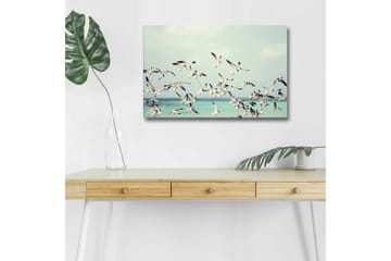 Lerretsbilde med LED-belysning - Flok med fugler som flyr over en blå havoverflate - Lyseblå / Hvit / Svart - Interiør - Maleri & posters - Lerretsbilder