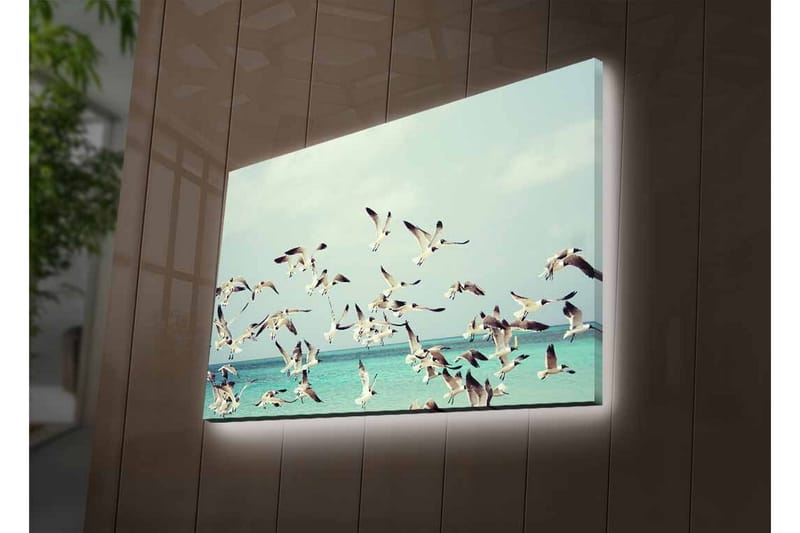 Lerretsbilde med LED-belysning - Flok med fugler som flyr over en blå havoverflate - Lyseblå / Hvit / Svart - Interiør - Maleri & posters - Lerretsbilder