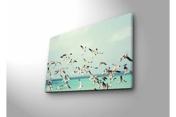 Lerretsbilde med LED-belysning - Flok med fugler som flyr over en blå havoverflate - Lyseblå / Hvit / Svart - Interiør - Maleri & posters - Lerretsbilder