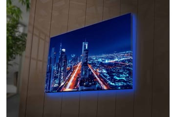 Lerretsbilde med LED-belysning - Nattlig bysilhuett med opplyste skyskrapere - Mørk blå / Lys oransje / Hvit - Interiør - Maleri & posters - Lerretsbilder