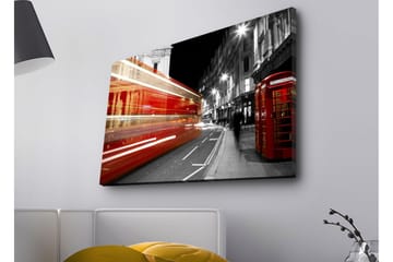 Lerretsbilde med LED-belysning - Rød buss i bevegelse på en svart-hvit bygate - Rød / Svart / Grå - Interiør - Maleri & posters - Lerretsbilder