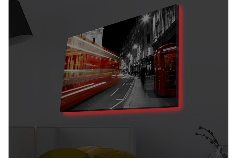 Lerretsbilde med LED-belysning - Rød buss i bevegelse på en svart-hvit bygate - Rød / Svart / Grå - Interiør - Maleri & posters - Lerretsbilder