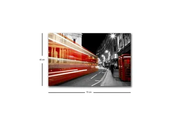 Lerretsbilde med LED-belysning - Rød buss i bevegelse på en svart-hvit bygate - Rød / Svart / Grå - Interiør - Maleri & posters - Lerretsbilder