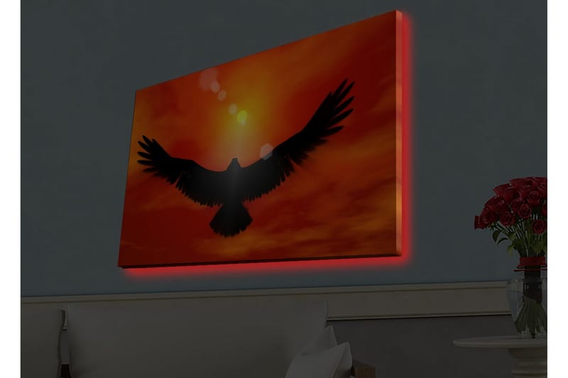 Lerretsbilde med LED-belysning - Silhuett av en ørn som flyr mot en solnedgang i sterke farger - Rød / Svart / Oransje - Interiør - Maleri & posters - Lerretsbilder