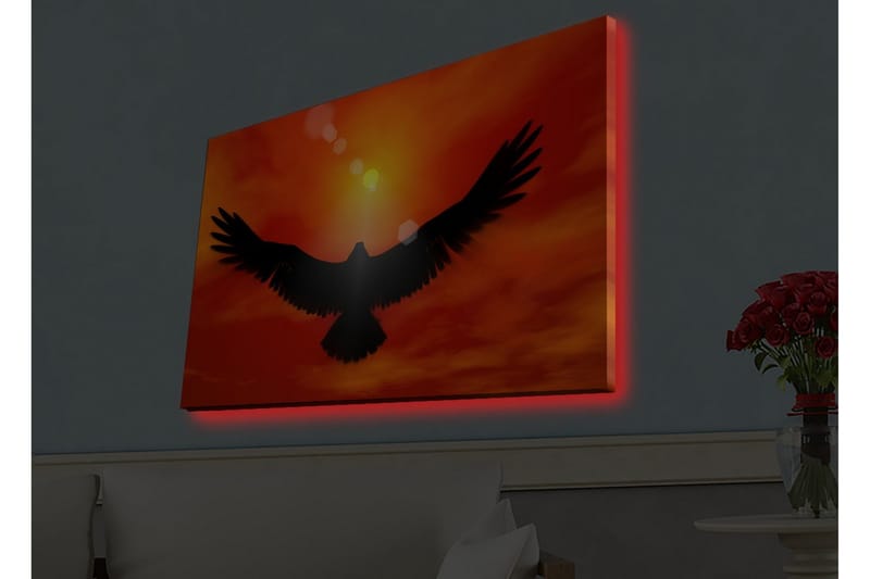 Lerretsbilde med LED-belysning - Silhuett av en ørn som flyr mot en solnedgang i sterke farger - Rød / Svart / Oransje - Interiør - Maleri & posters - Lerretsbilder