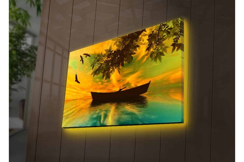 Lerretsbilde med LED-belysning - Silhuett av en båt på speilblankt vann med en fargerik solnedgang - Gul / Grønn / Svart - Interiør - Maleri & posters - Lerretsbilder