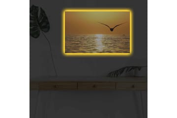 Lerretsbilde med LED-belysning - Solnedgang over havet med en fugl i flukt - Gull / Oransje / Svart - Interiør - Maleri & posters - Lerretsbilder