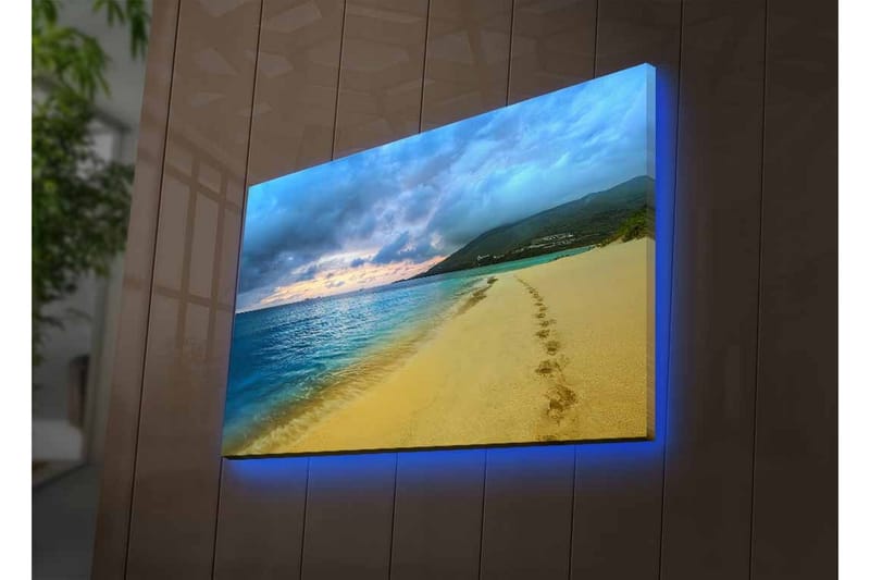 Lerretsbilde med LED-belysning - Vakker strand med fotspor i sanden og en dramatisk himmel - Blå / Sandgul / Grå - Interiør - Maleri & posters - Lerretsbilder