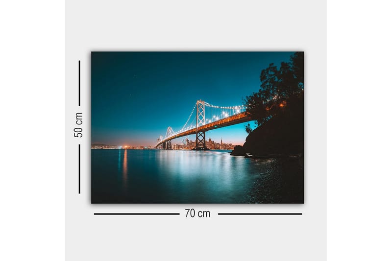 Lerretsbilde - Opplyst bro over en stille vannflate med byens skyline i bakgrunnen - Blå / Oransje / Svart - Interiør - Maleri & posters - Lerretsbilder