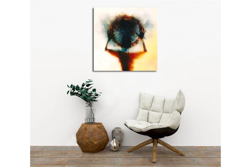 Lerretsbilde - Silhuett av en person som holder en sirkel av farger og lys - Svart / Blå / Rød - Interiør - Maleri & posters - Lerretsbilder