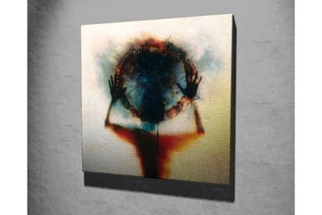 Lerretsbilde - Silhuett av en person som holder en sirkel av farger og lys - Svart / Blå / Rød - Interiør - Maleri & posters - Lerretsbilder