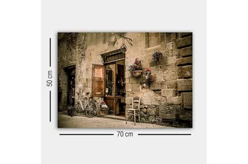 Lerretsbilde - Sjarmerende gatebilde med sykkel og åpen dør til butikk - Beige / Brun / Grønn - Interiør - Maleri & posters - Lerretsbilder