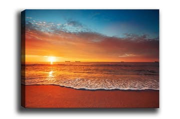 Lerretsbilde - Solnedgang over havet med myke bølger på stranden - Oransje / Blå / Beige - Interiør - Maleri & posters - Lerretsbilder