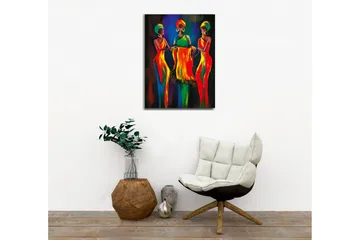 Lerretsbilde - Tre kvinner i fargerike kjoler som holder et stoffstykke sammen - Rød / Gul / Grønn - Interiør - Maleri & posters - Lerretsbilder