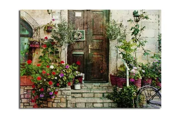 Stort lerretsbilde 100x70 cm - Vakker dør omgitt av fargerike blomster og grøntområder - Rød / Grønn / Lilla - Interiør - Maleri & posters - Lerretsbilder
