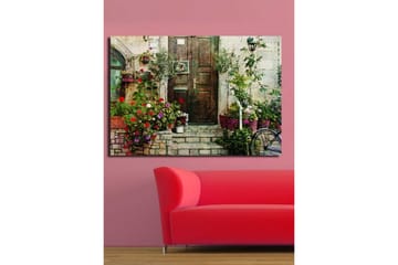 Stort lerretsbilde 100x70 cm - Vakker dør omgitt av fargerike blomster og grøntområder - Rød / Grønn / Lilla - Interiør - Maleri & posters - Lerretsbilder